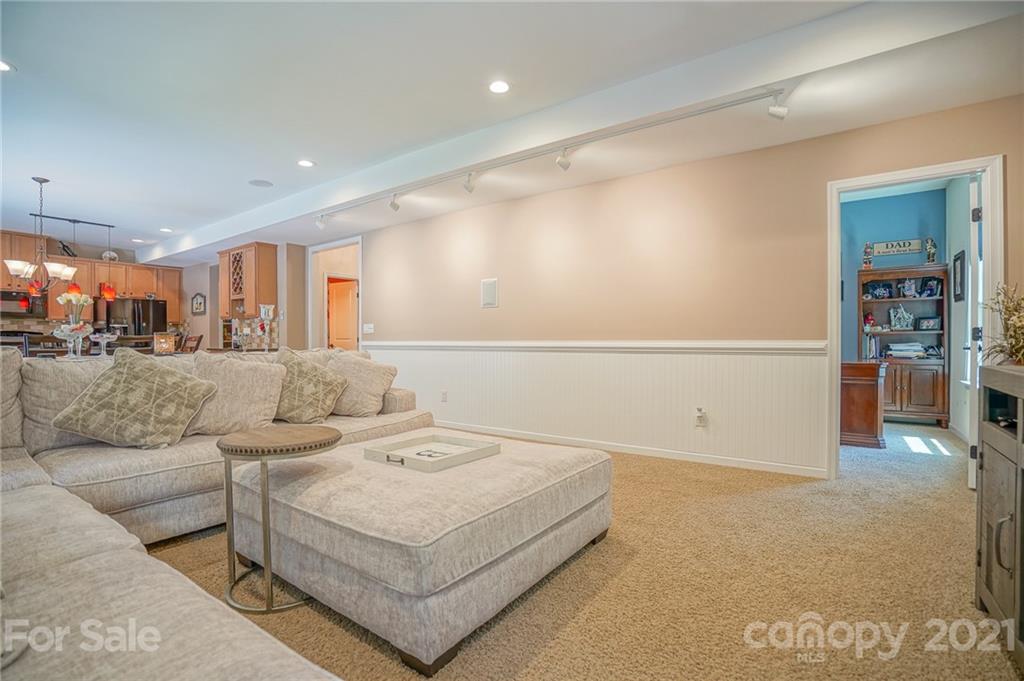 7788 East Berkeley Road, Unit 1106 Denver, NC 28037 - Photo 21 of 48 a living room with furniture and kitchen view