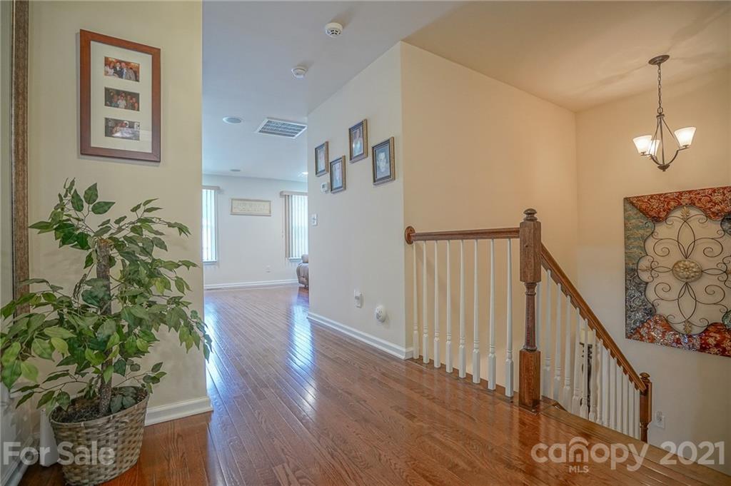 7788 East Berkeley Road, Unit 1106 Denver, NC 28037 - Photo 22 of 48 a view of entryway with wooden floor