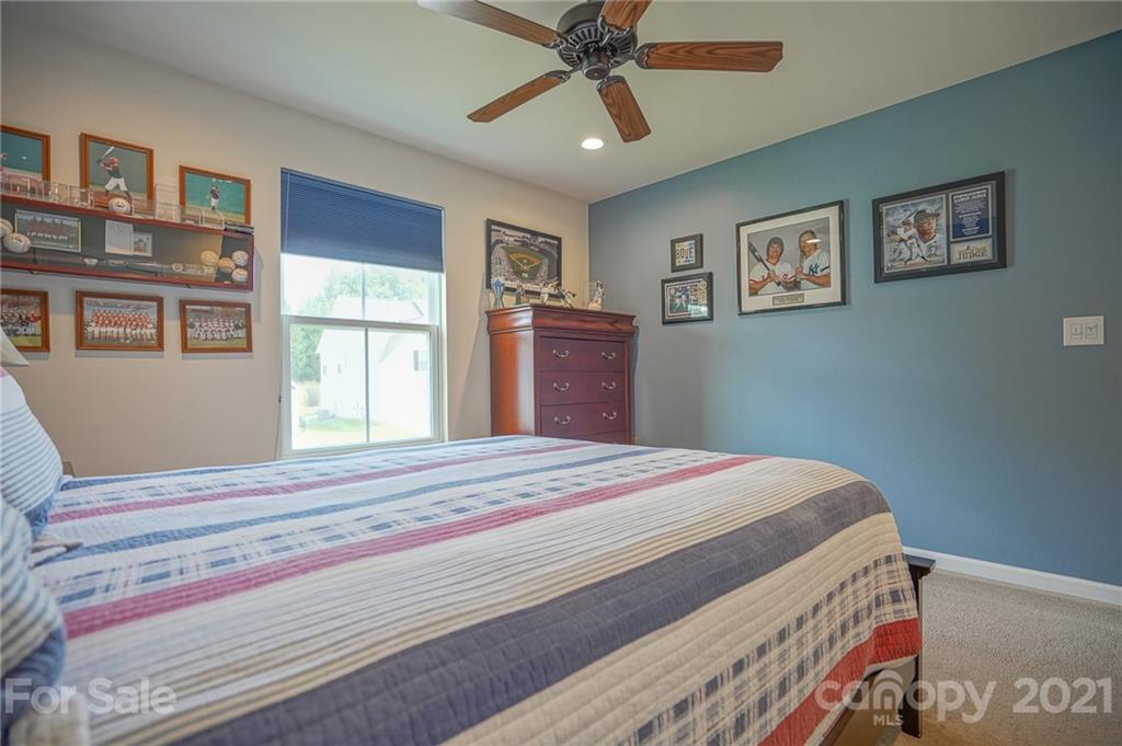 7788 East Berkeley Road, Unit 1106 Denver, NC 28037 - Photo 26 of 48 a bedroom with bed and a window