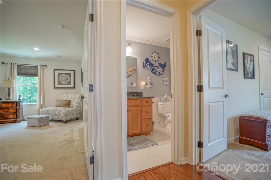 7788 East Berkeley Road, Unit 1106 Denver, NC 28037 - Photo 32 of 48 a bedroom with furniture and a window