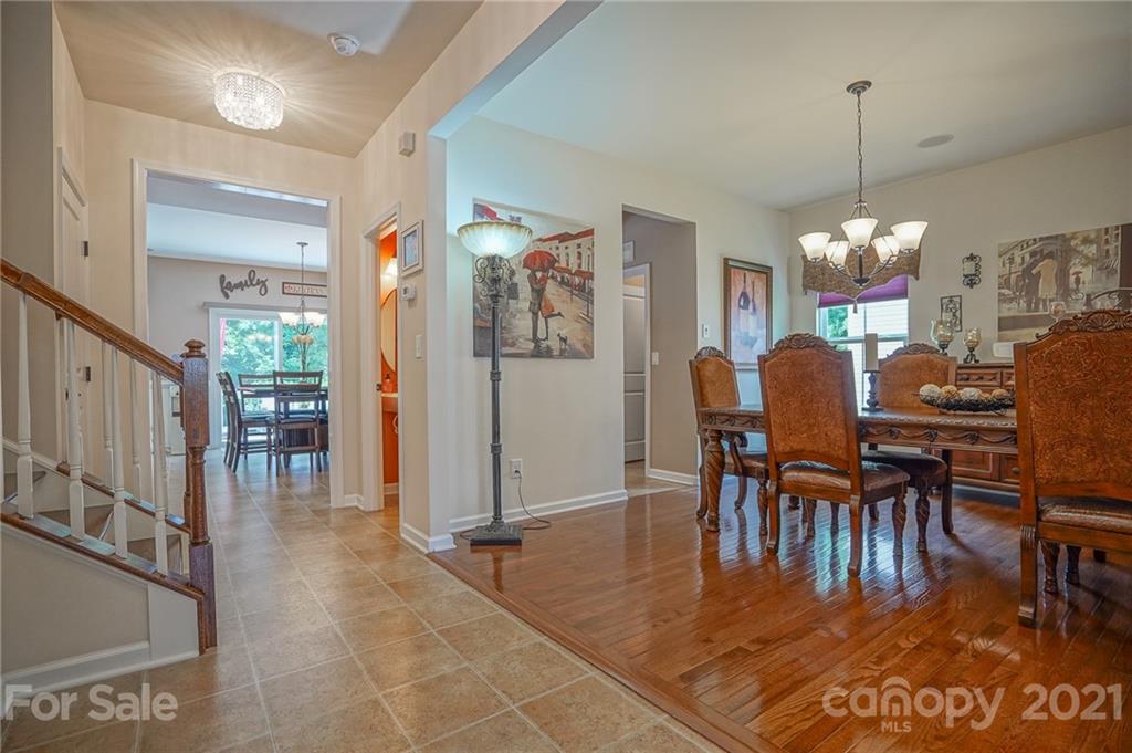 7788 East Berkeley Road, Unit 1106 Denver, NC 28037 - Photo 5 of 48 a dining room filled with furniture and window