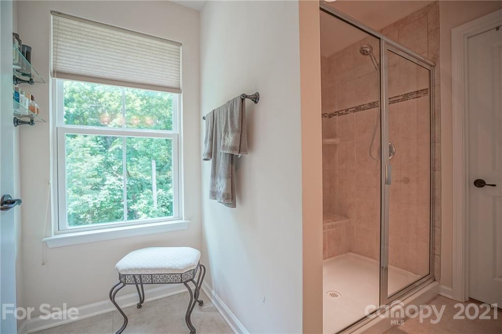 7788 East Berkeley Road, Unit 1106 Denver, NC 28037 - Photo 41 of 48 a bathroom with a window and a shower