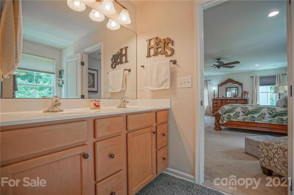7788 East Berkeley Road, Unit 1106 Denver, NC 28037 - Photo 42 of 48 a bathroom with a sink and a mirror