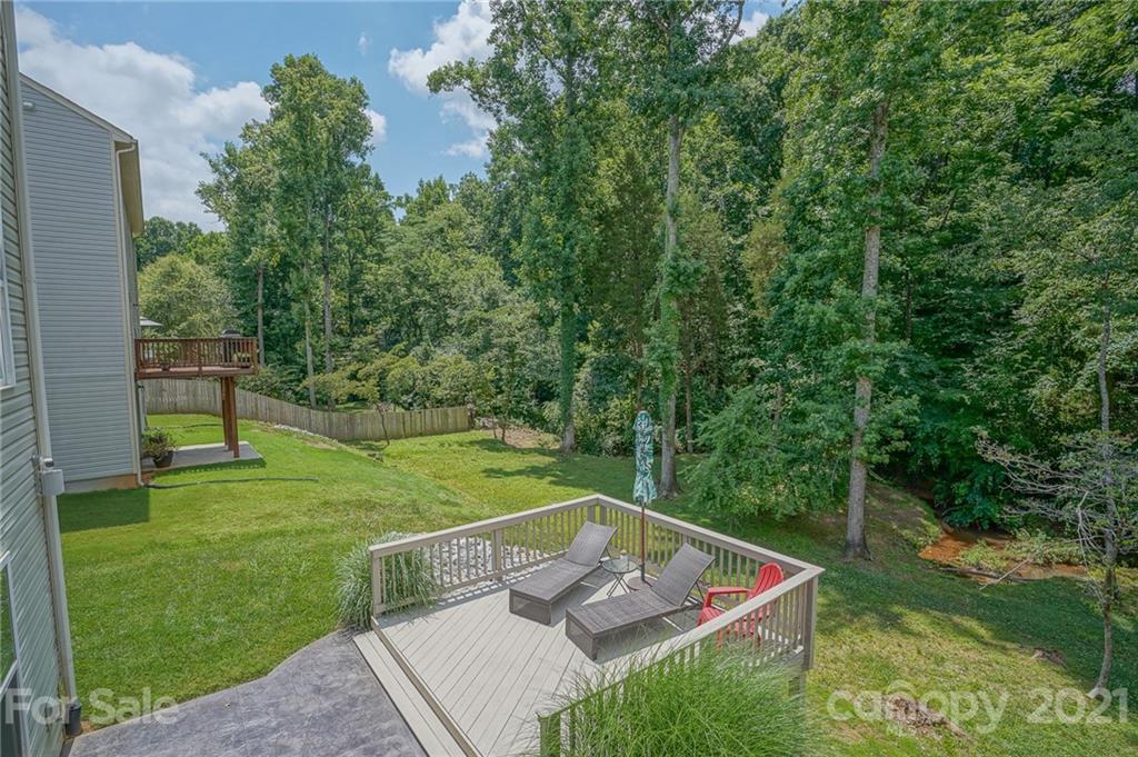 7788 East Berkeley Road, Unit 1106 Denver, NC 28037 - Photo 45 of 48 a view of a backyard with swimming pool