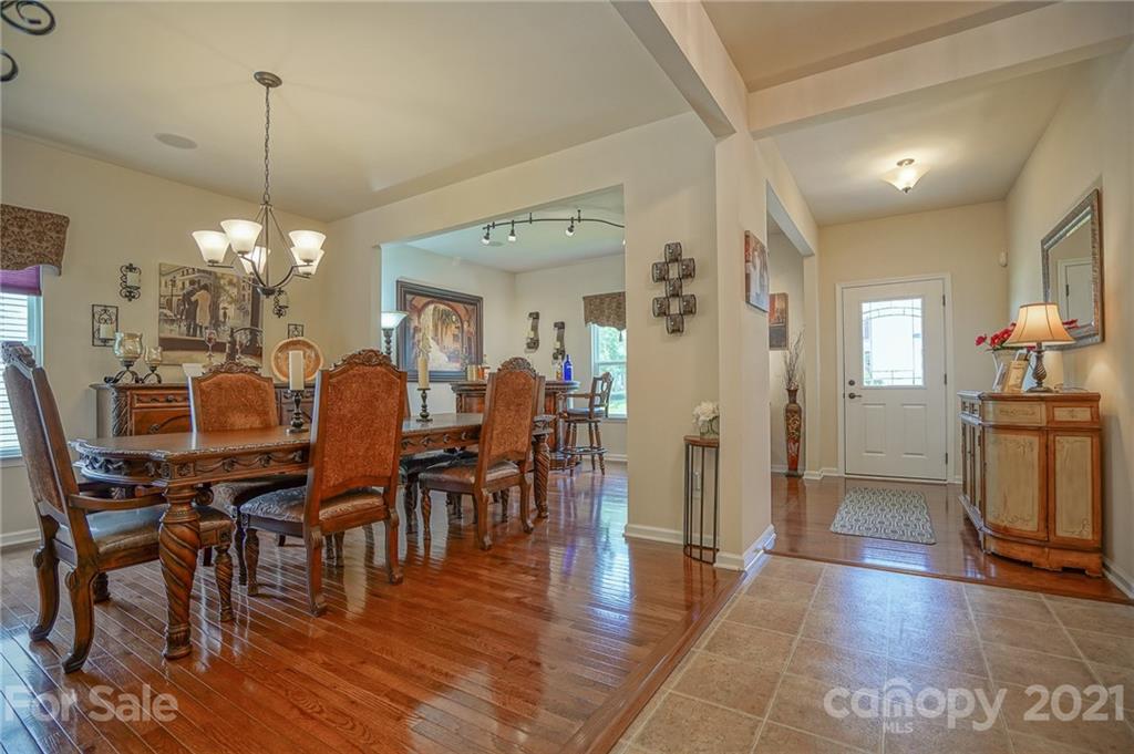 7788 East Berkeley Road, Unit 1106 Denver, NC 28037 - Photo 8 of 48 a view of a dining room with furniture window and wooden floor