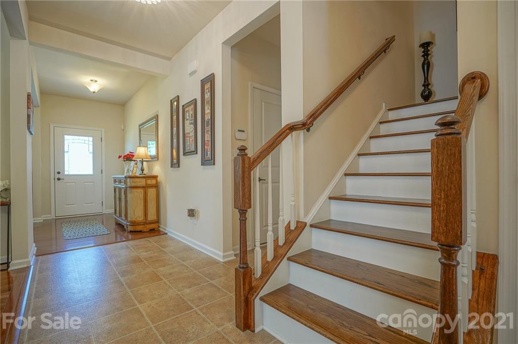 7788 East Berkeley Road, Unit 1106 Denver, NC 28037 - Photo 10 of 48 a view of a hallway with wooden floor and staircase