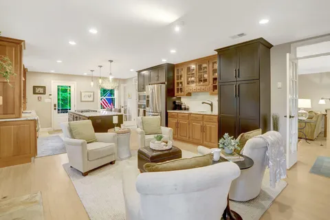 a kitchen with stainless steel appliances granite countertop a sink and cabinets