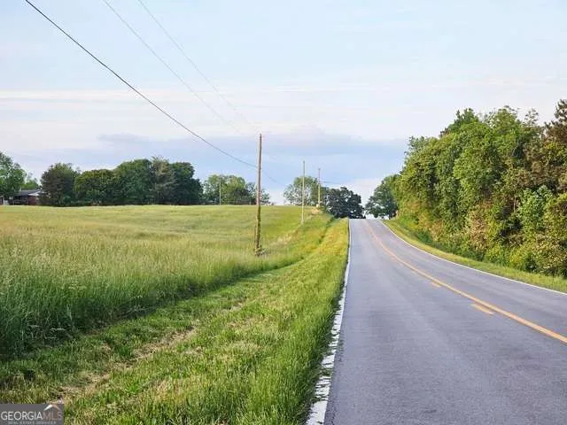 a view of a lake with a big yard