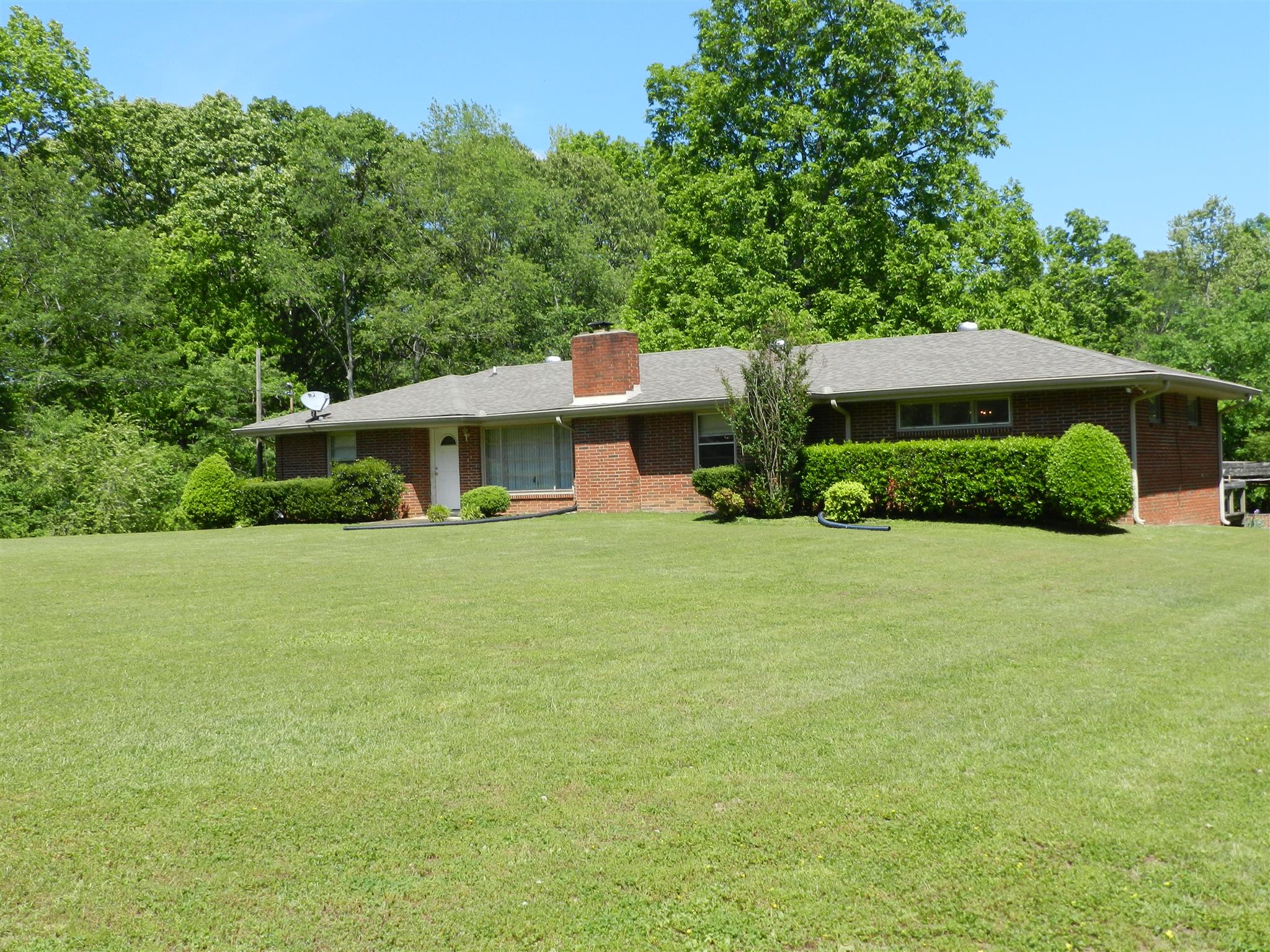 7107 Fernvale Road Fairview, TN 37062 - Photo 1 of 21 a front view of a house with garden