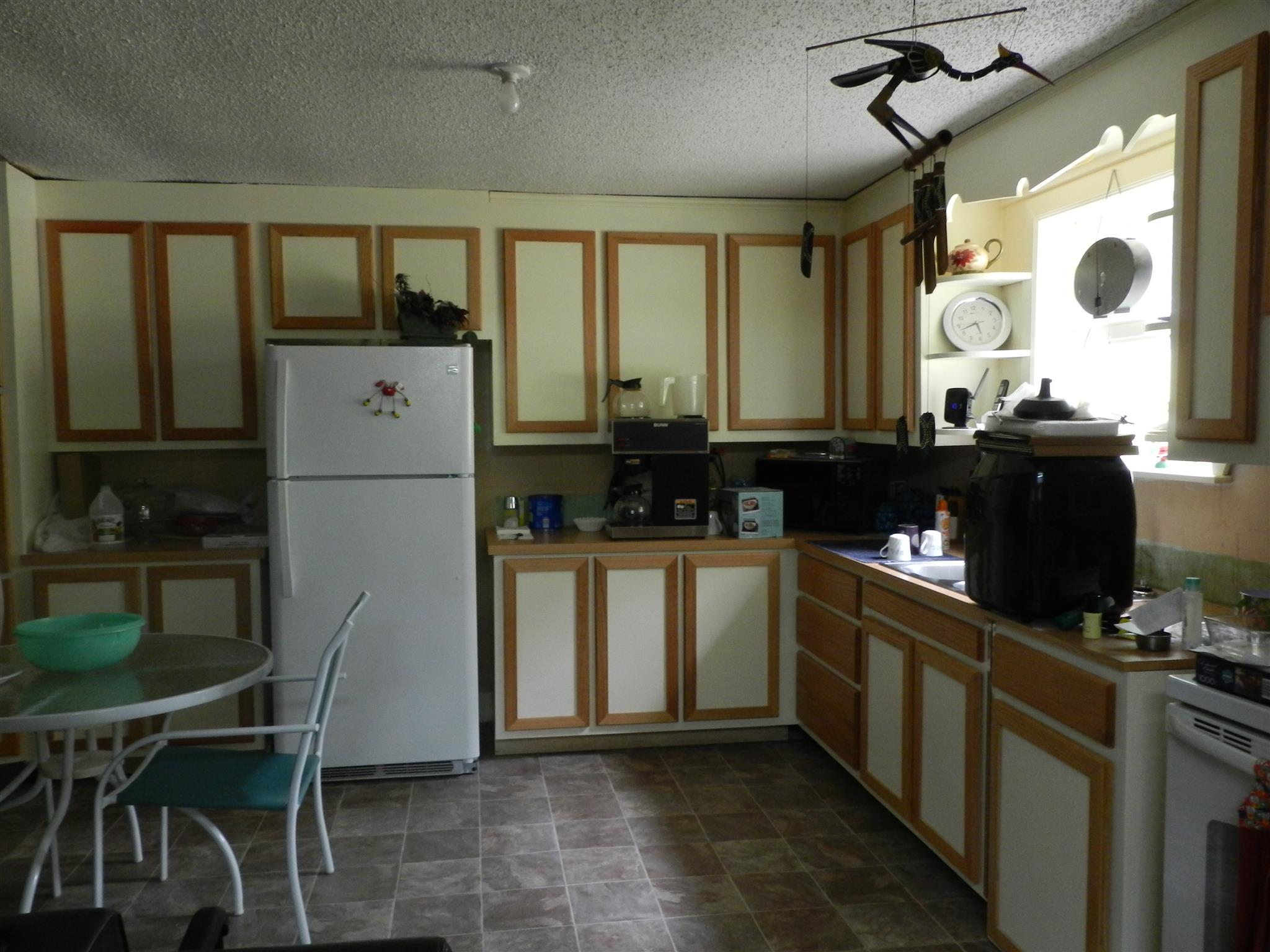 7107 Fernvale Road Fairview, TN 37062 - Photo 13 of 21 a kitchen with a refrigerator and a stove