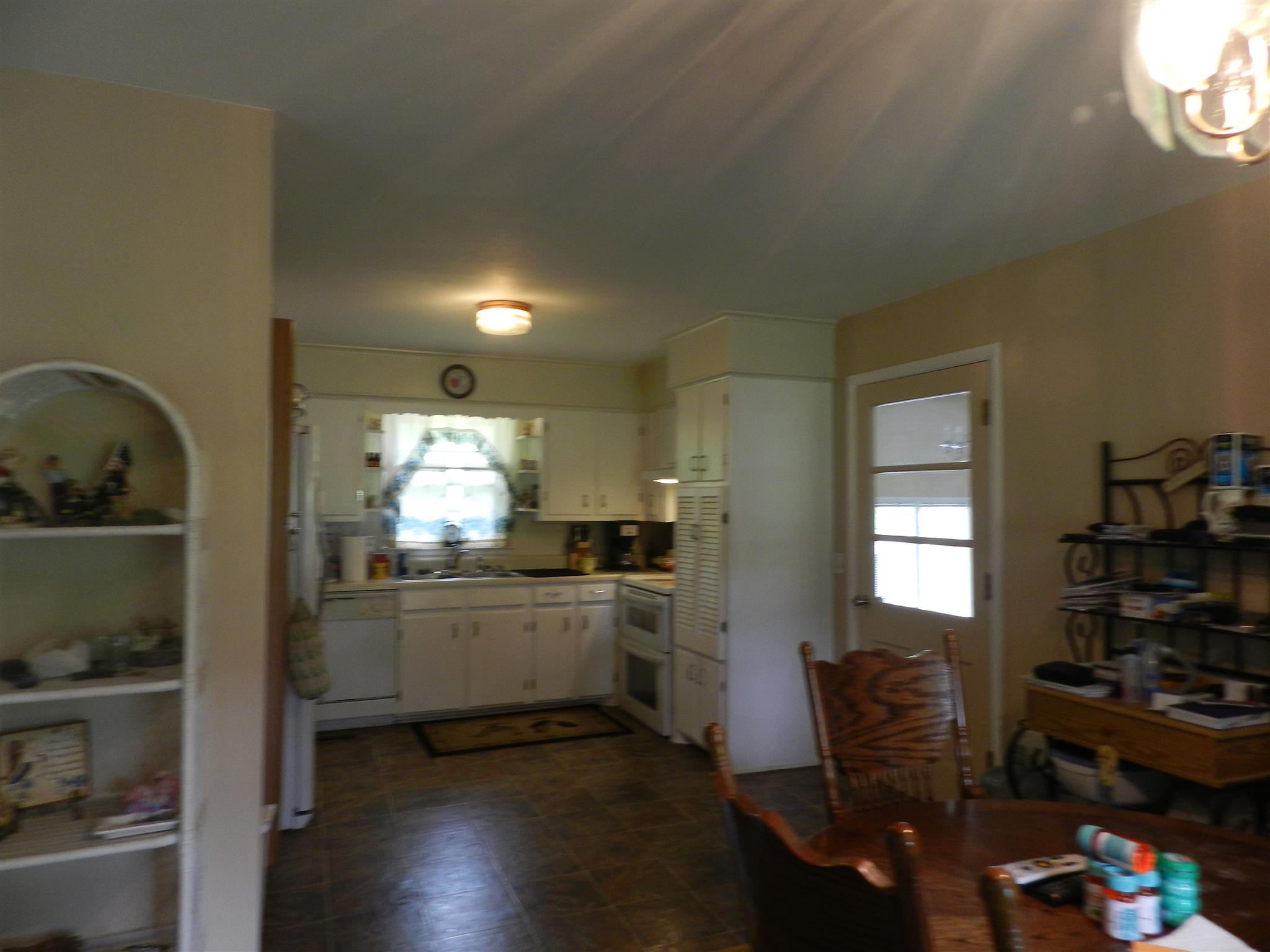 7107 Fernvale Road Fairview, TN 37062 - Photo 5 of 21 a kitchen with stainless steel appliances kitchen island granite countertop a stove and a refrigerator