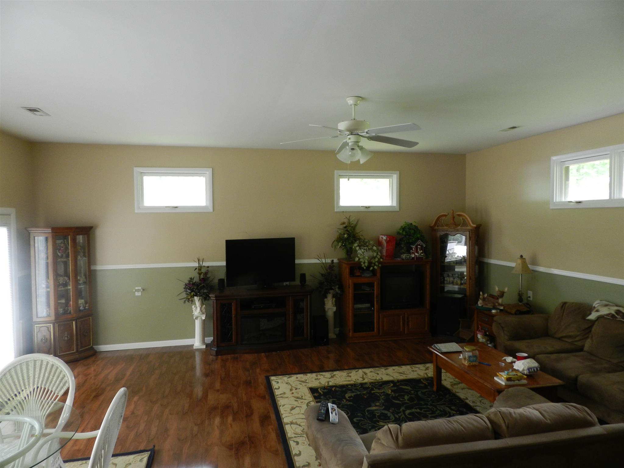 7107 Fernvale Road Fairview, TN 37062 - Photo 6 of 21 a living room with furniture and a flat screen tv