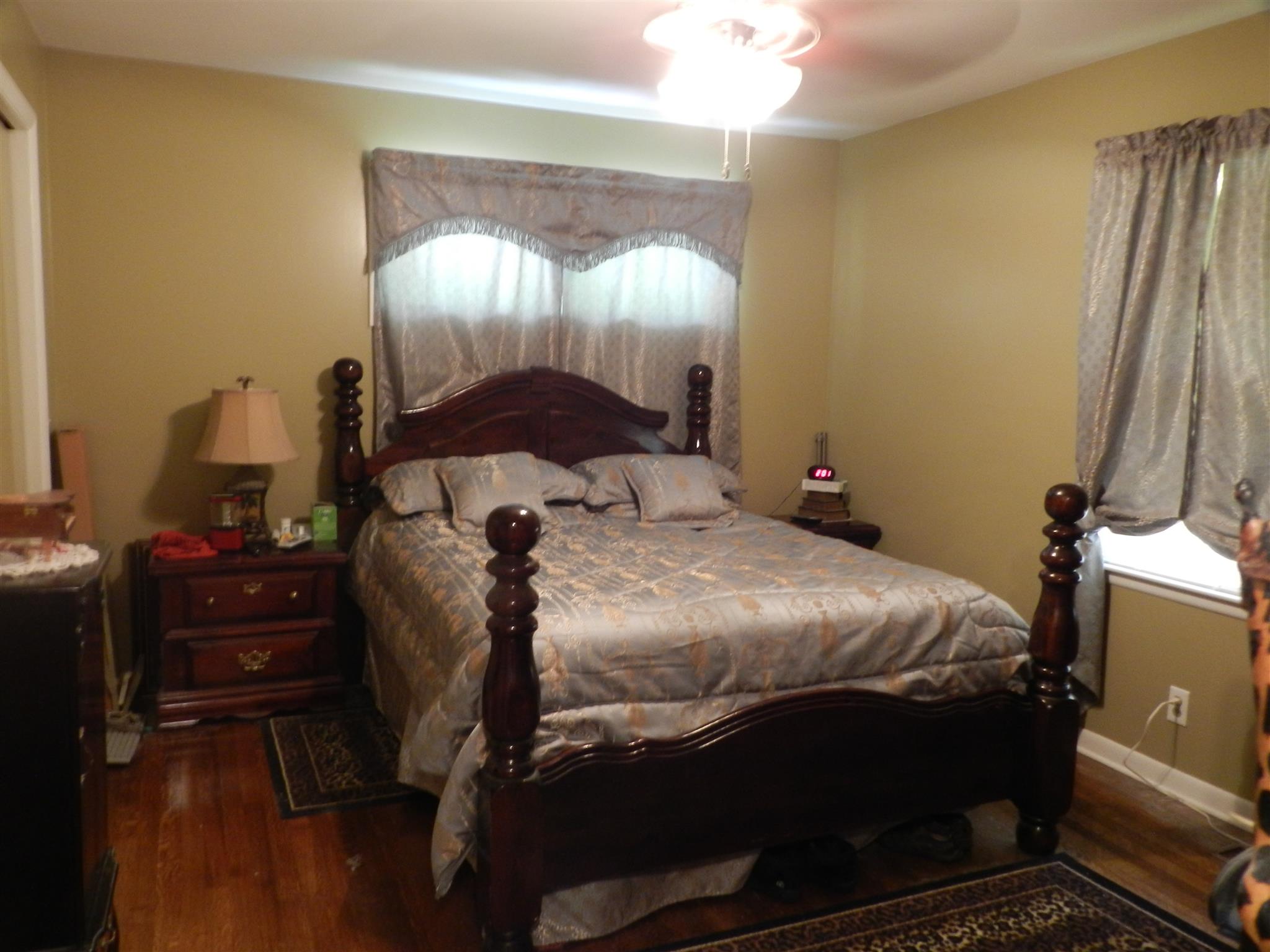 7107 Fernvale Road Fairview, TN 37062 - Photo 8 of 21 a bed sitting in a bedroom next to a window