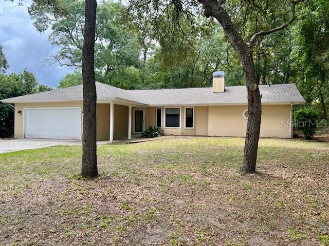 19626 Southwest 93rd Place Dunnellon, FL 34432 - Photo 1 of 14 front view of a house with a yard