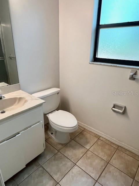 19626 Southwest 93rd Place Dunnellon, FL 34432 - Photo 11 of 14 a bathroom with a toilet sink and vanity