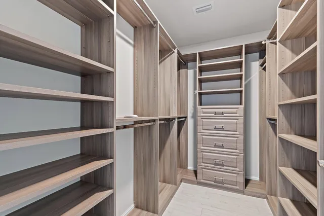 a bathroom with a bathtub and a sink