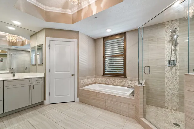 a spacious bathroom with a bathtub and a sink