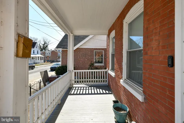 a view of balcony with wooden floor