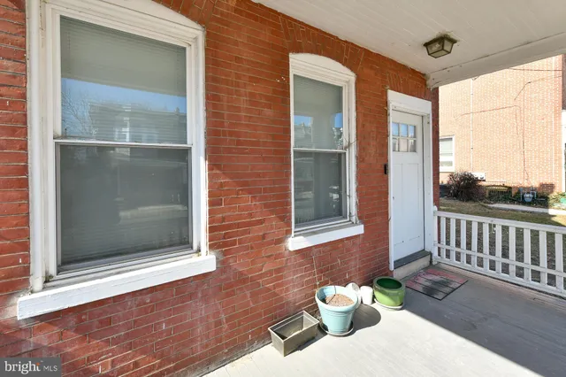 a view of a door and chair and door front of the house
