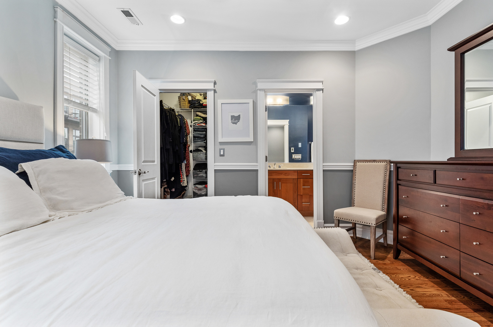 1037 West Monroe Street, Unit 3 Chicago, IL 60607 - Photo 13 of 25 a bedroom with a bed and large mirror