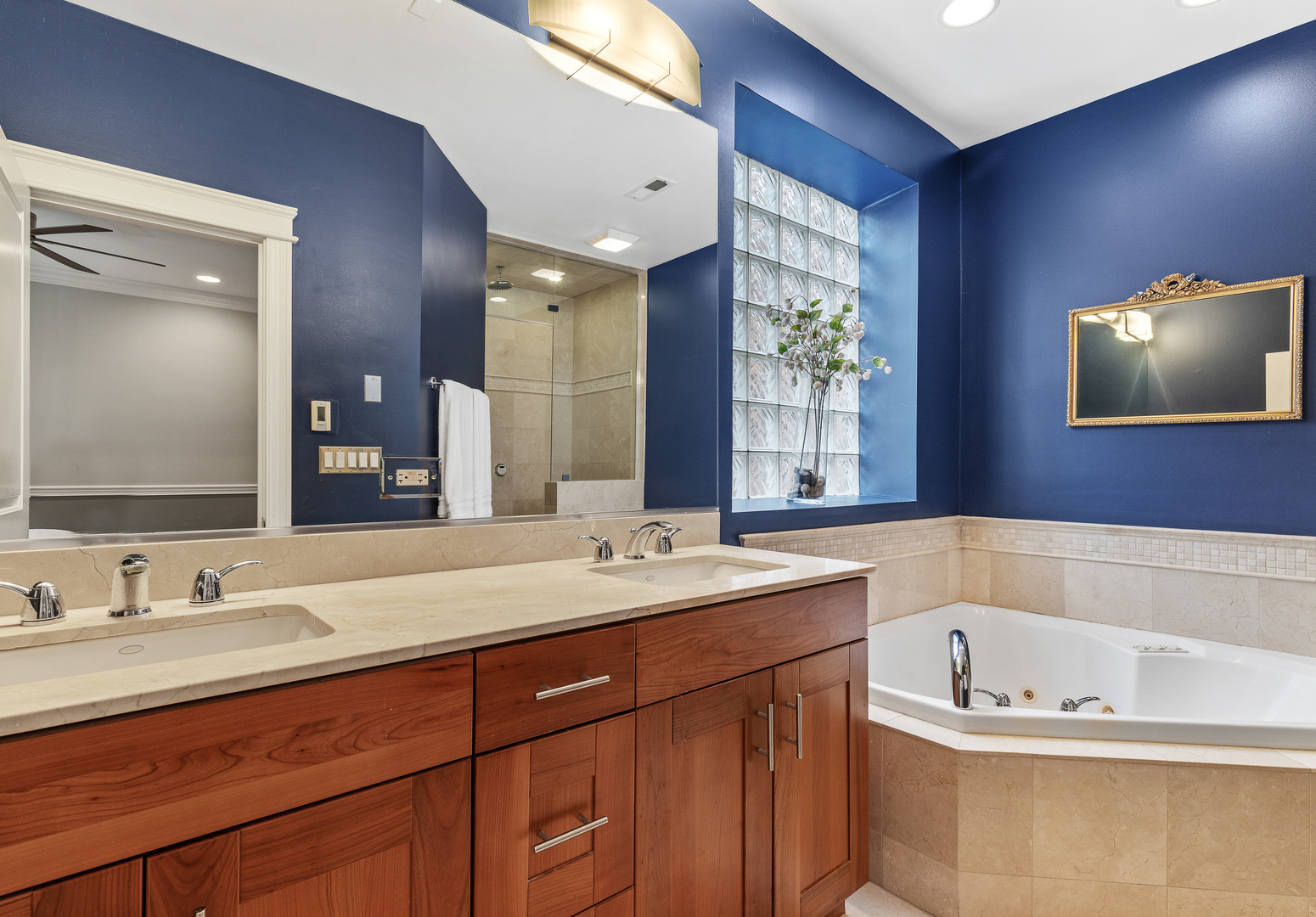 1037 West Monroe Street, Unit 3 Chicago, IL 60607 - Photo 14 of 25 a bathroom with a tub a sink and mirror