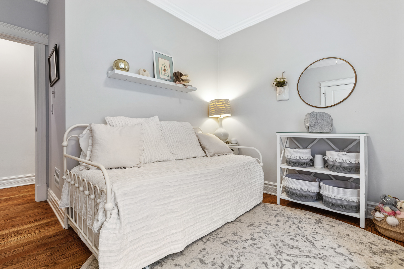 1037 West Monroe Street, Unit 3 Chicago, IL 60607 - Photo 18 of 25 a bedroom with a bed mirror and window