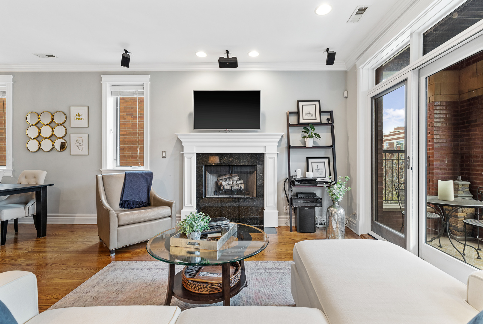 1037 West Monroe Street, Unit 3 Chicago, IL 60607 - Photo 3 of 25 a living room with furniture flat screen tv and a fireplace