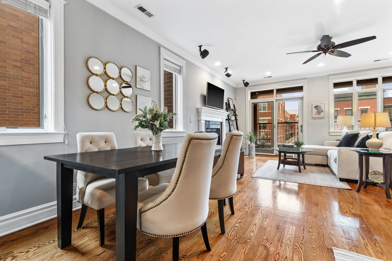 1037 West Monroe Street, Unit 3 Chicago, IL 60607 - Photo 7 of 25 a view of a dining room with furniture window and wooden floor