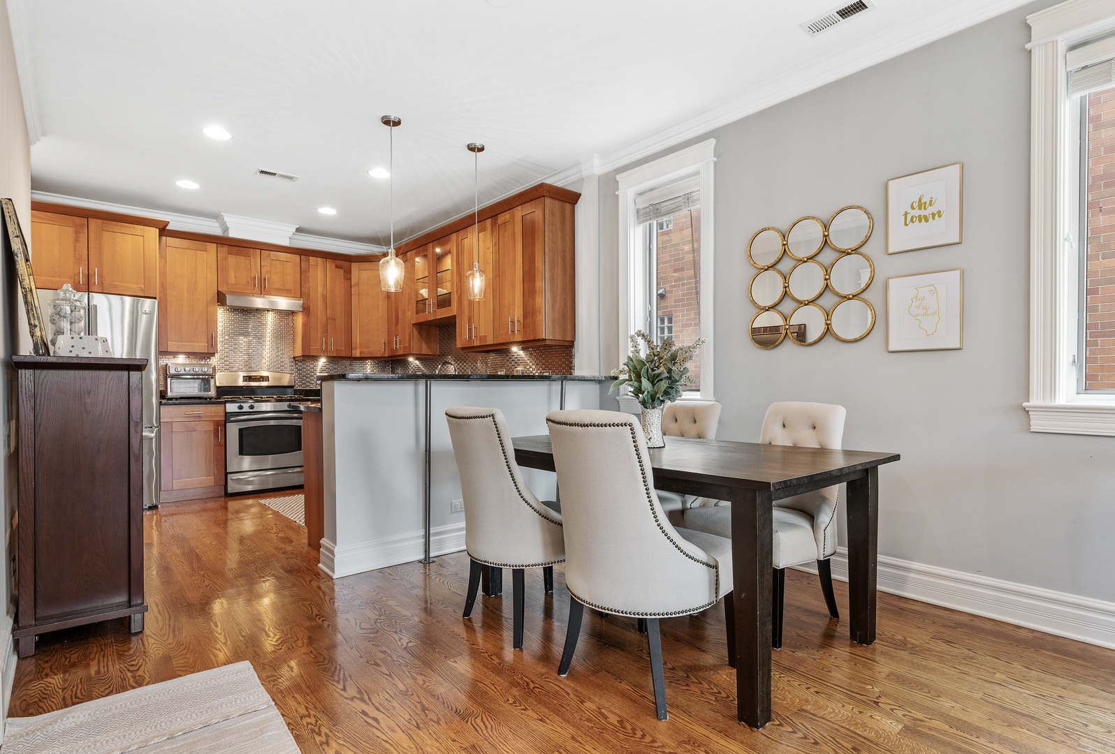 1037 West Monroe Street, Unit 3 Chicago, IL 60607 - Photo 8 of 25 a view of kitchen with cabinets table and chairs