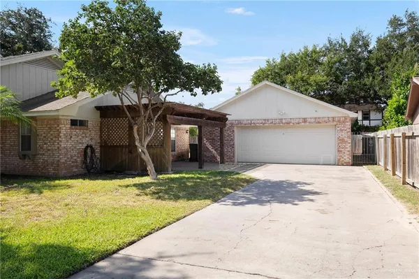 a house with a tree in front of it