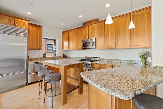 a kitchen with a table and chairs in it