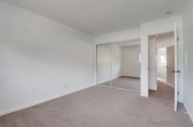 a view of an empty room and closet