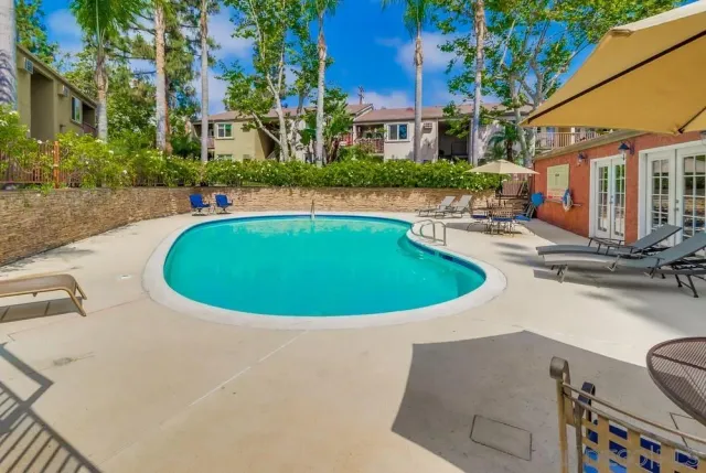 a view of a swimming pool with a patio