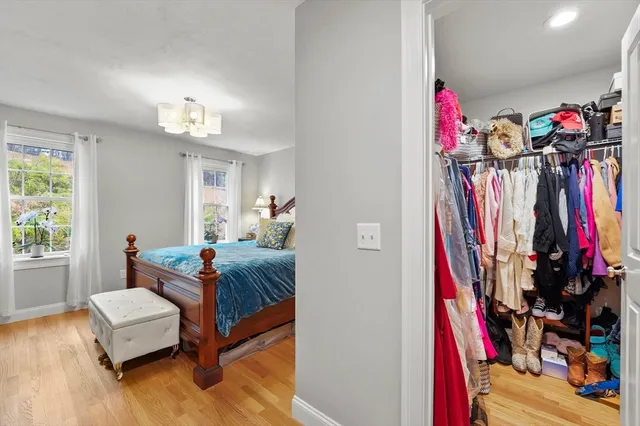 a bed room with a bed and a window