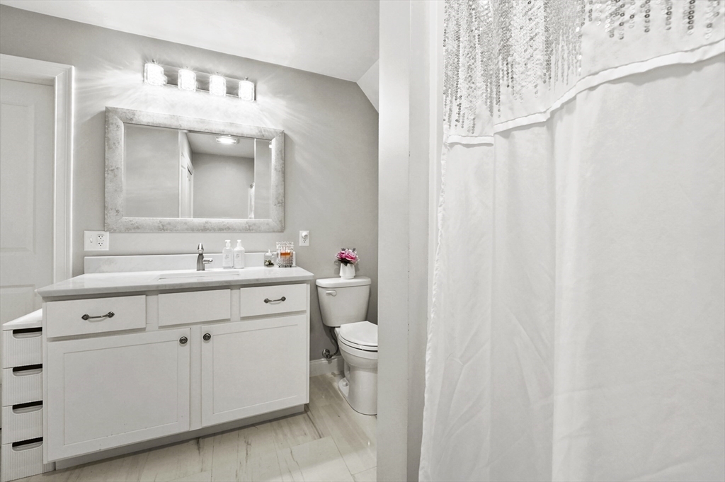 17 Turtle Lane, Unit 17 Sterling, MA 01564 - Photo 16 of 26 a spacious bathroom with a double vanity sink mirror and toilet