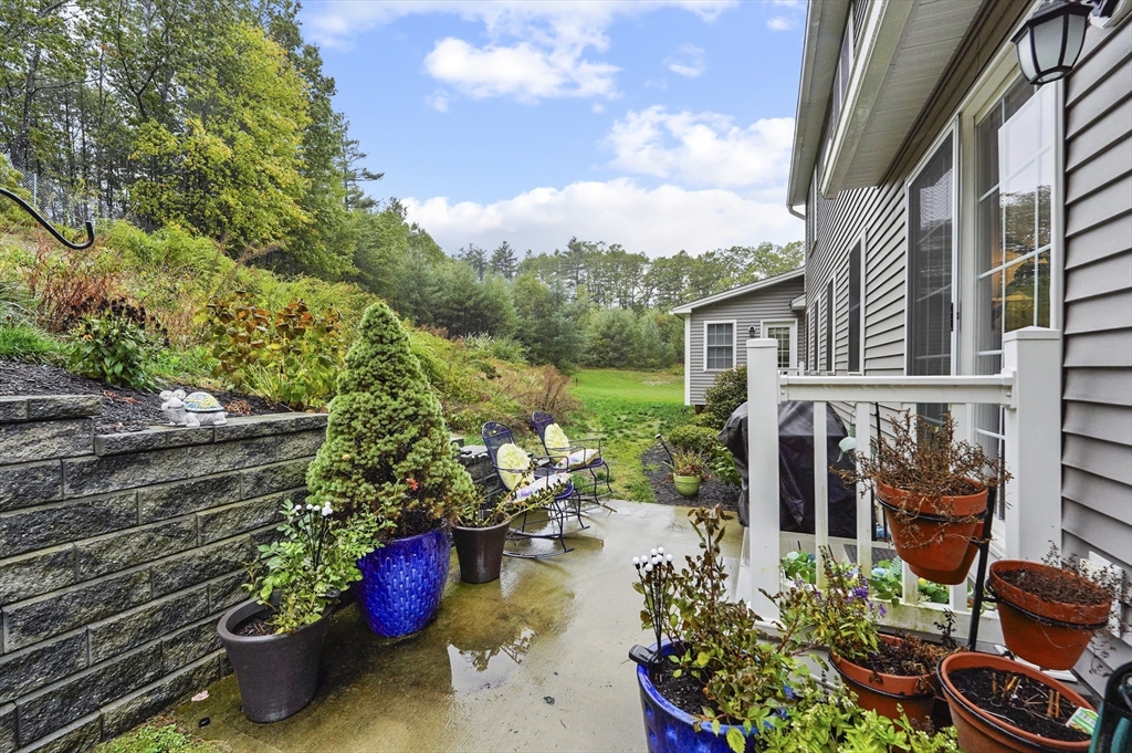 17 Turtle Lane, Unit 17 Sterling, MA 01564 - Photo 23 of 26 a backyard of a house with lots of green space