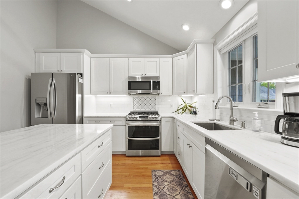17 Turtle Lane, Unit 17 Sterling, MA 01564 - Photo 7 of 26 a kitchen with white cabinets and stainless steel appliances