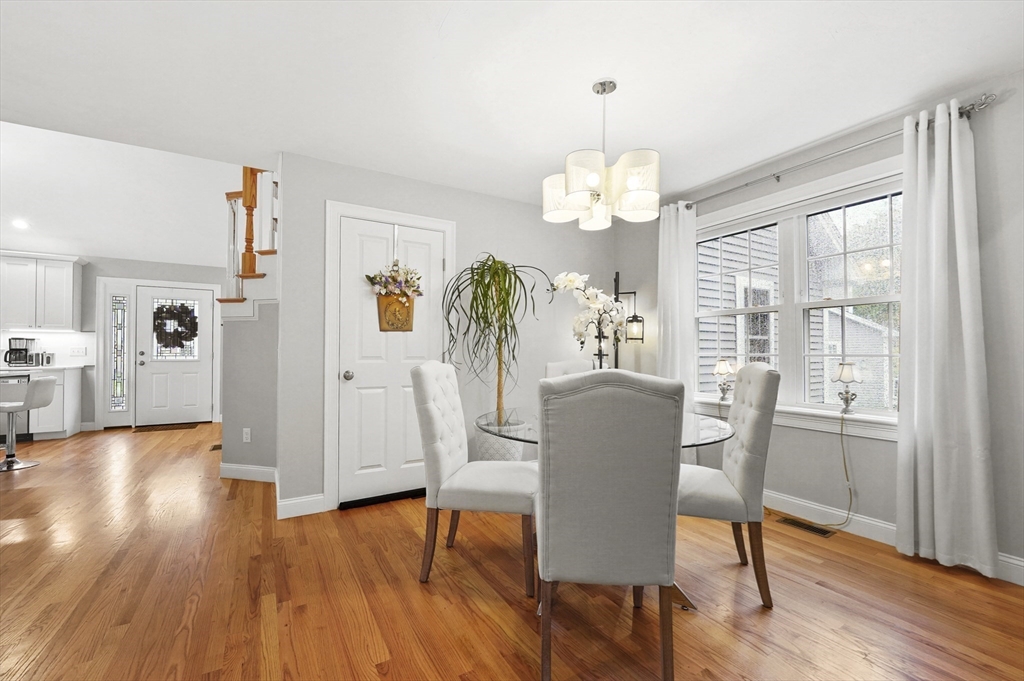 17 Turtle Lane, Unit 17 Sterling, MA 01564 - Photo 9 of 26 a view of a dining room with furniture wooden floor and chandelier