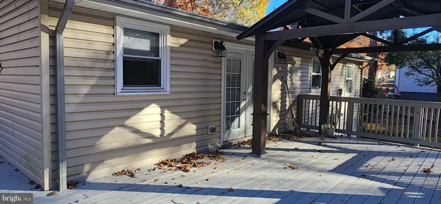 a view of balcony with wooden floor