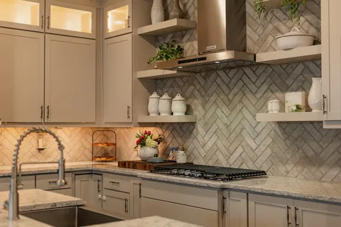 a kitchen with a stove and cabinets