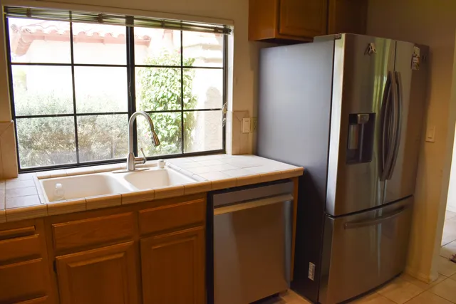 a bedroom with a bed and a night stand