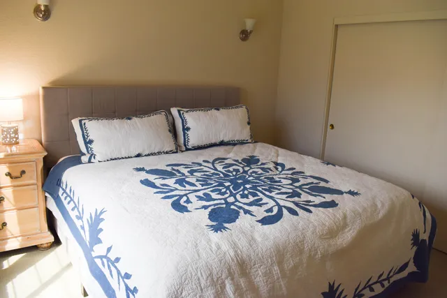 a white toilet sitting next to a white sink