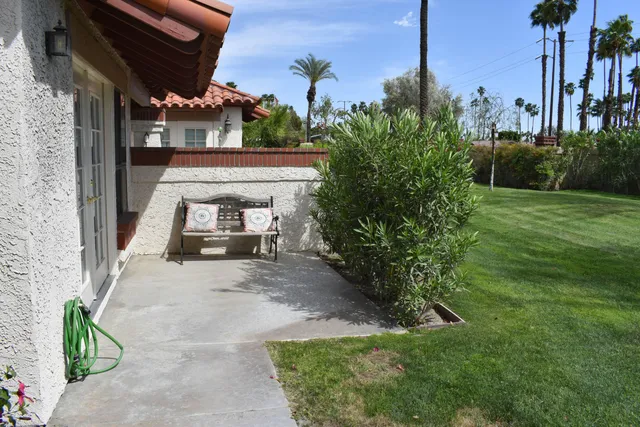 a view of a chairs and table in the patio