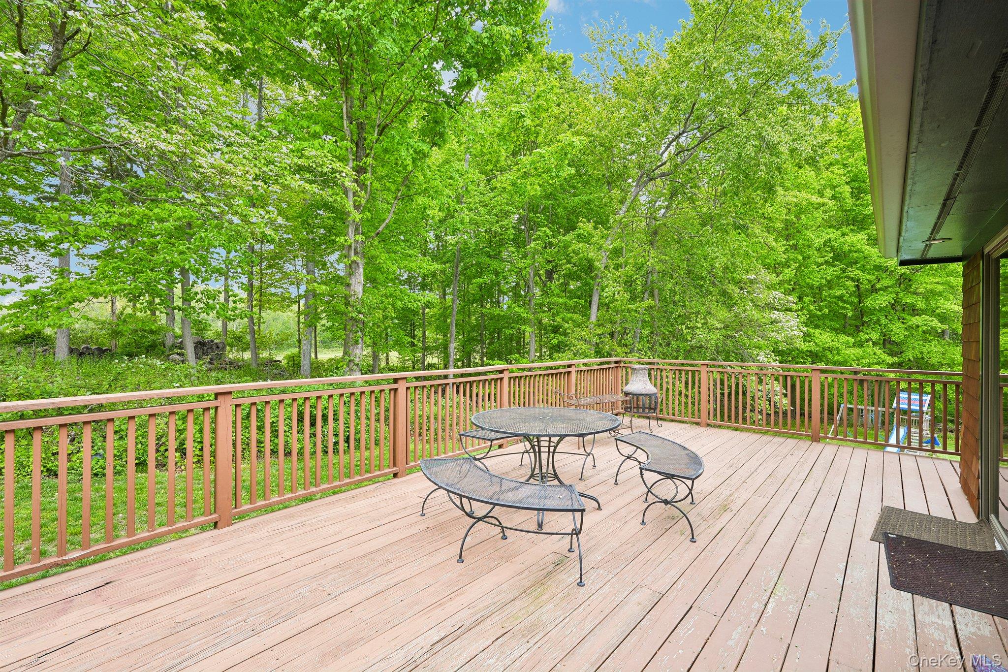 27 Cat Ridge Road North Salem, NY 10560 - Photo 42 of 49 a view of balcony with wooden floor and outdoor seating