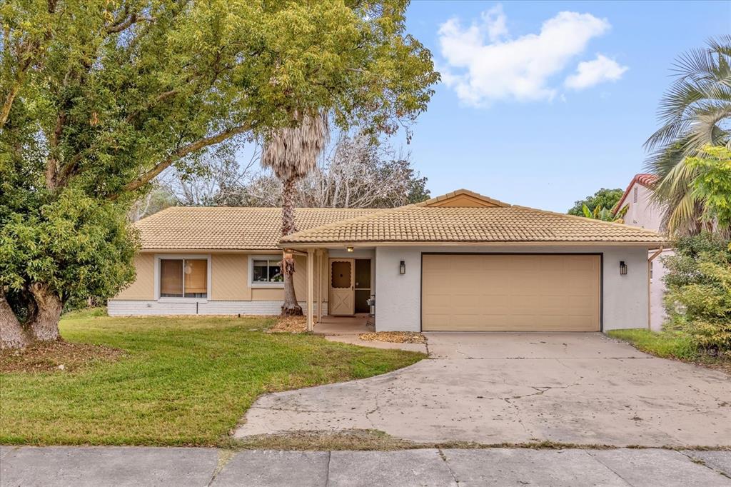 5237 Gateway Avenue Orlando, FL 32821 - Photo 1 of 1 a front view of a house with a garden and yard