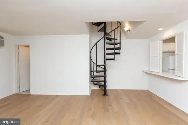 a view of an empty room and stairs