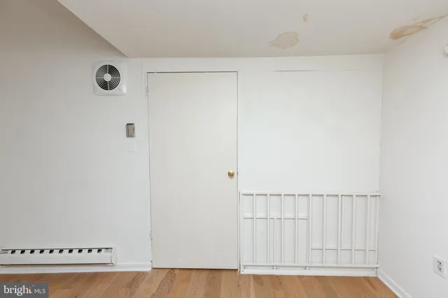 a view of a hallway with a white walls