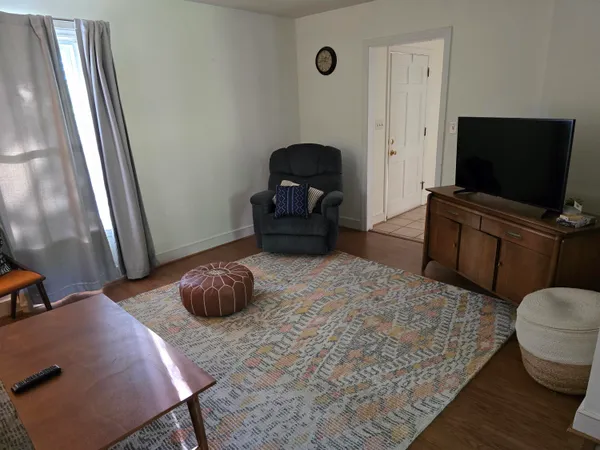 a bedroom with a bed and flat screen tv