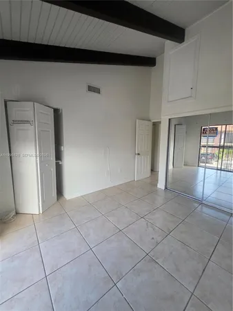 a bathroom with a shower and a toilet