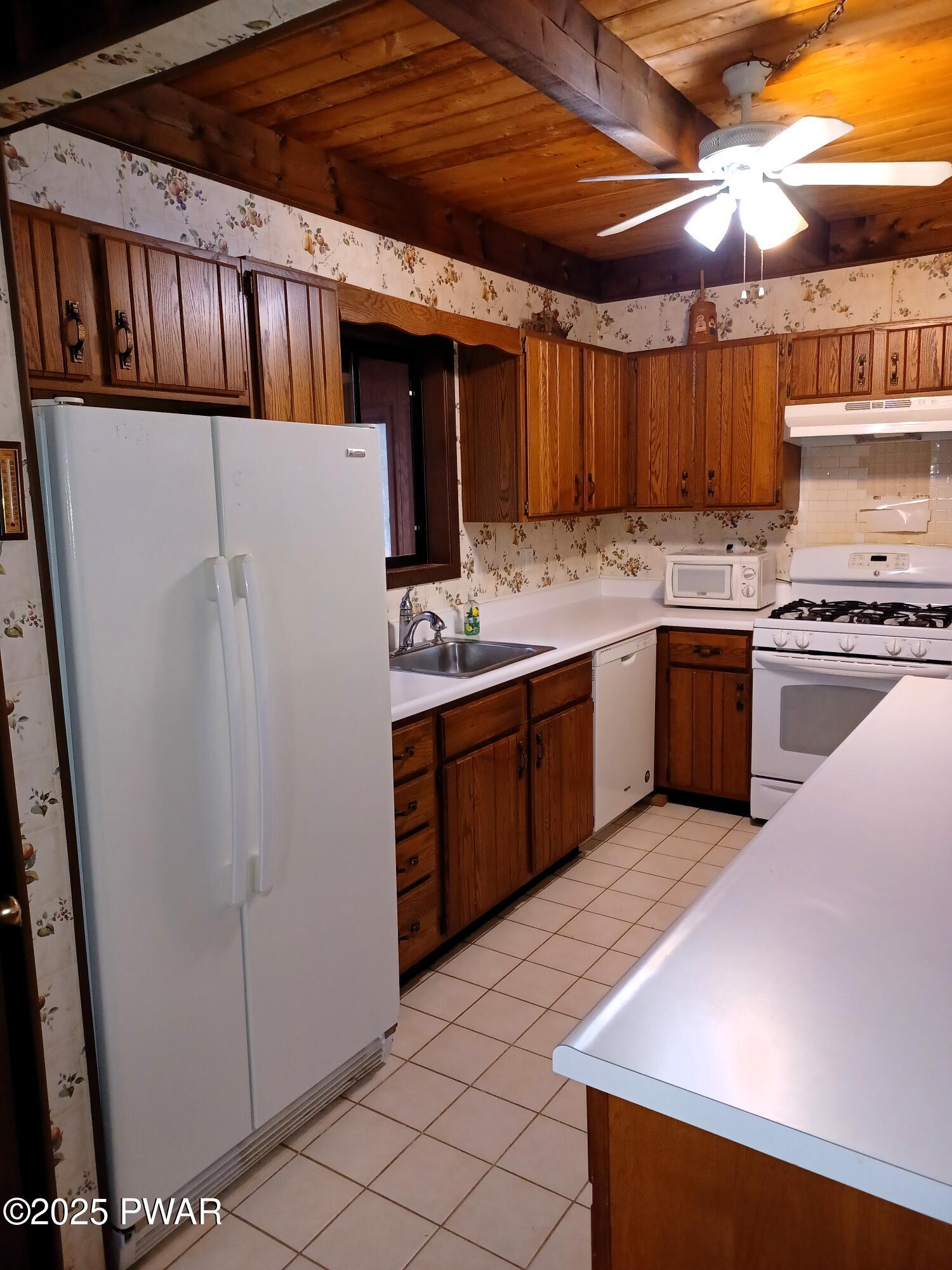 540 Northgate Road Lake Ariel, PA 18436 - Photo 6 of 40 a kitchen with stainless steel appliances granite countertop a stove sink and cabinets